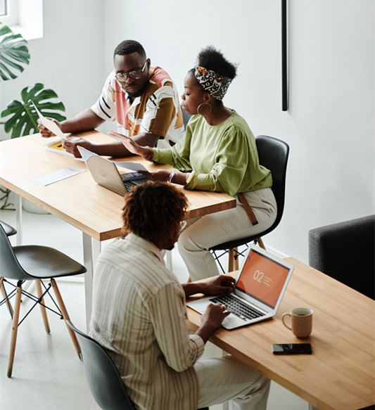 Canva - 2 Women Sitting on Chair in Front of Table_ Canva - 2 Women Sitting on Chair in Front of Table_