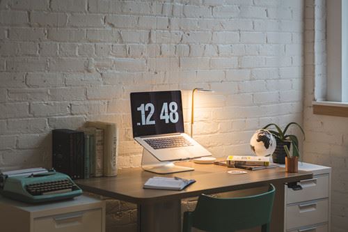 Canva - Macbook on Desk Beside Table Lamp_
